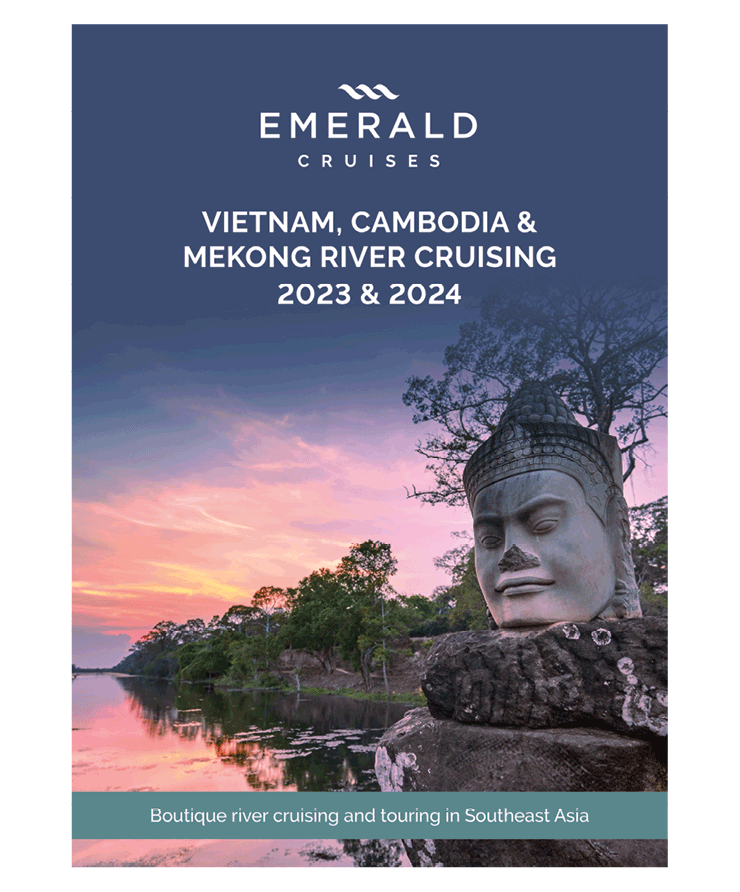 A luxury river cruise brochure, featuring a religious statue near the banks as the sun sets over the Mekong