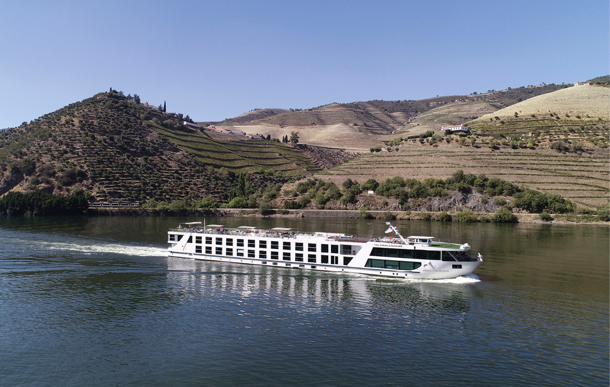 A luxury river ship sailing through the Douro Valley in Portugal