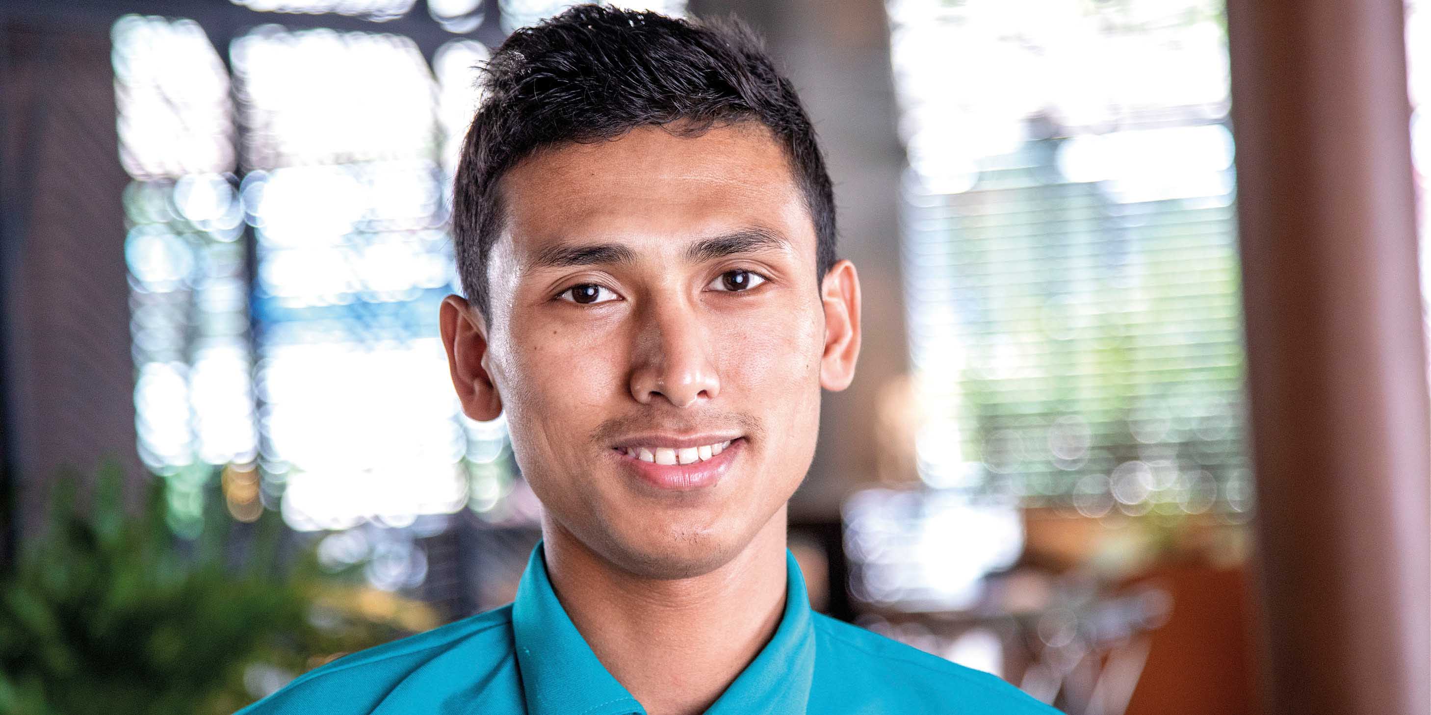 Member of staff on board a luxury river ship in Southeast Asia