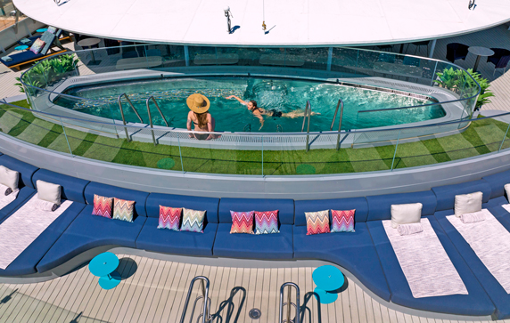 Two people swimming in Vitality pool on board super yacht